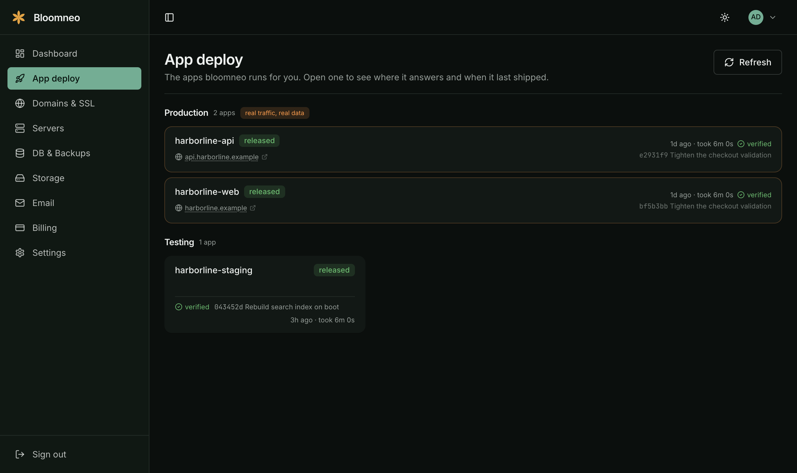 The App deploy page listing production and testing applications with their latest release and commit