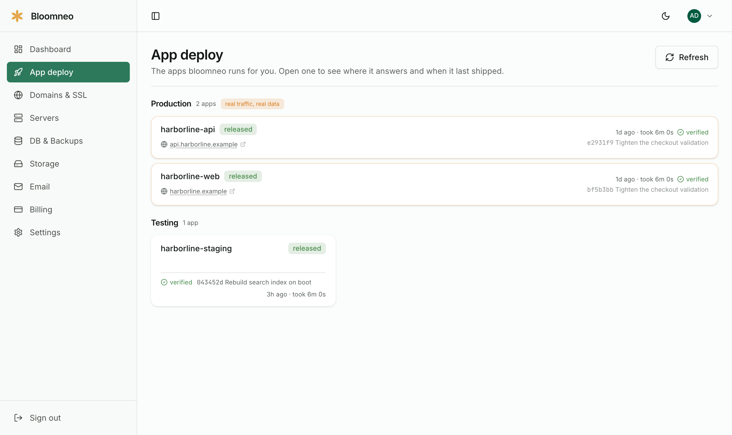 The App deploy page listing production and testing applications with their latest release and commit